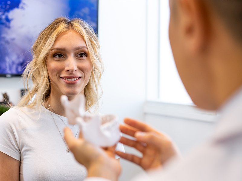 Photo of a smiling patient during a consultation