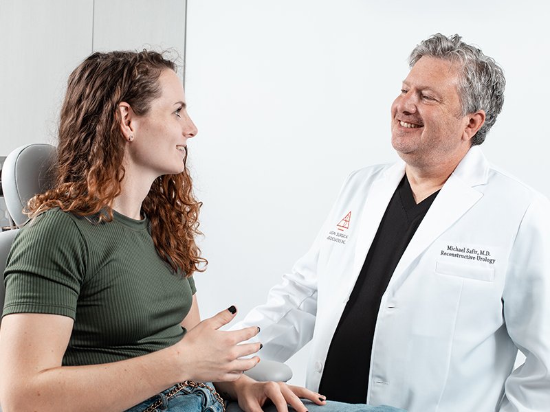 Photo of Dr. Michael Safir speaking with a patient