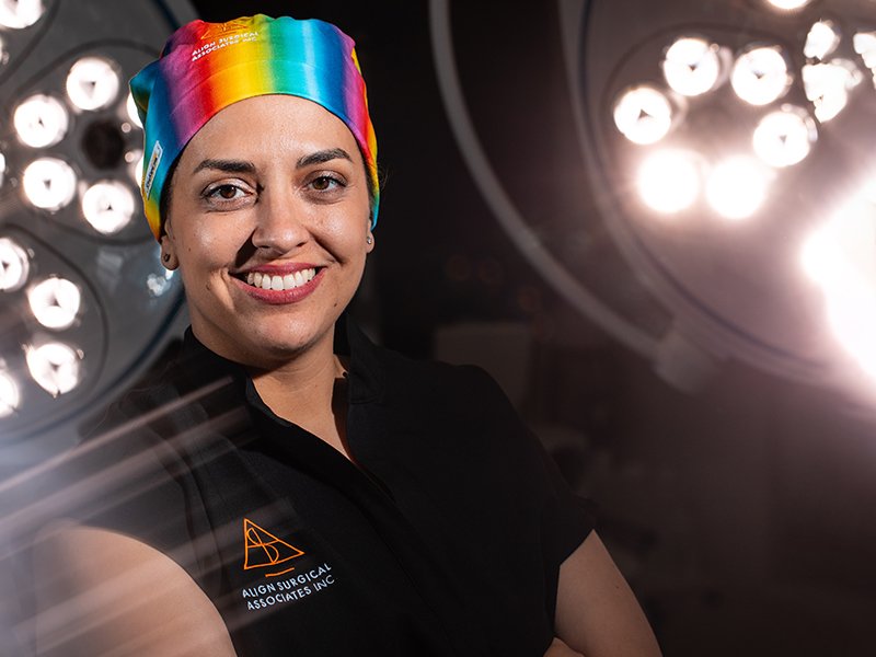 Photo of Dr. Breanna Jedrezejewski wearing a rainbow scrub cap