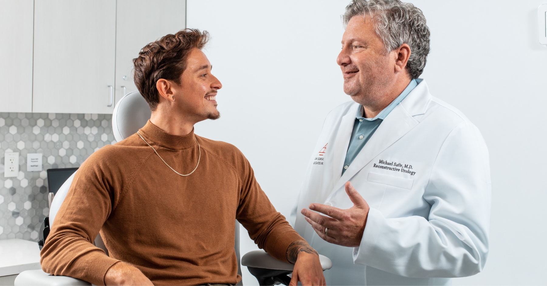 Photo of Dr. Michael Safir consulting with a pateint.