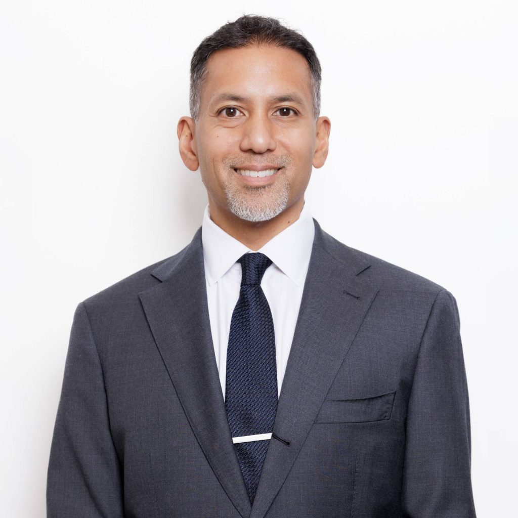 Professional portrait of Dr. Gurjala in a suit