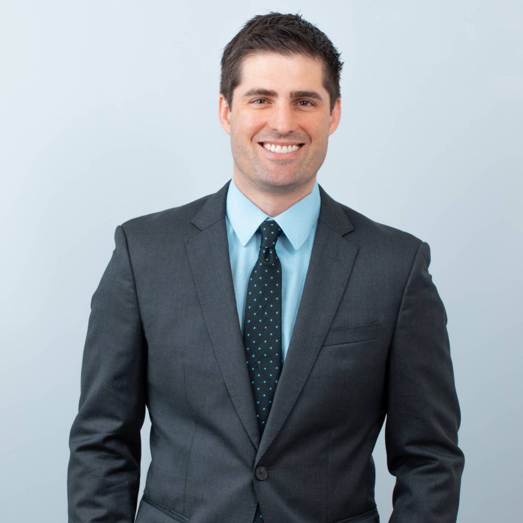 Professional portrait of Dr. Mittermiller in a suit