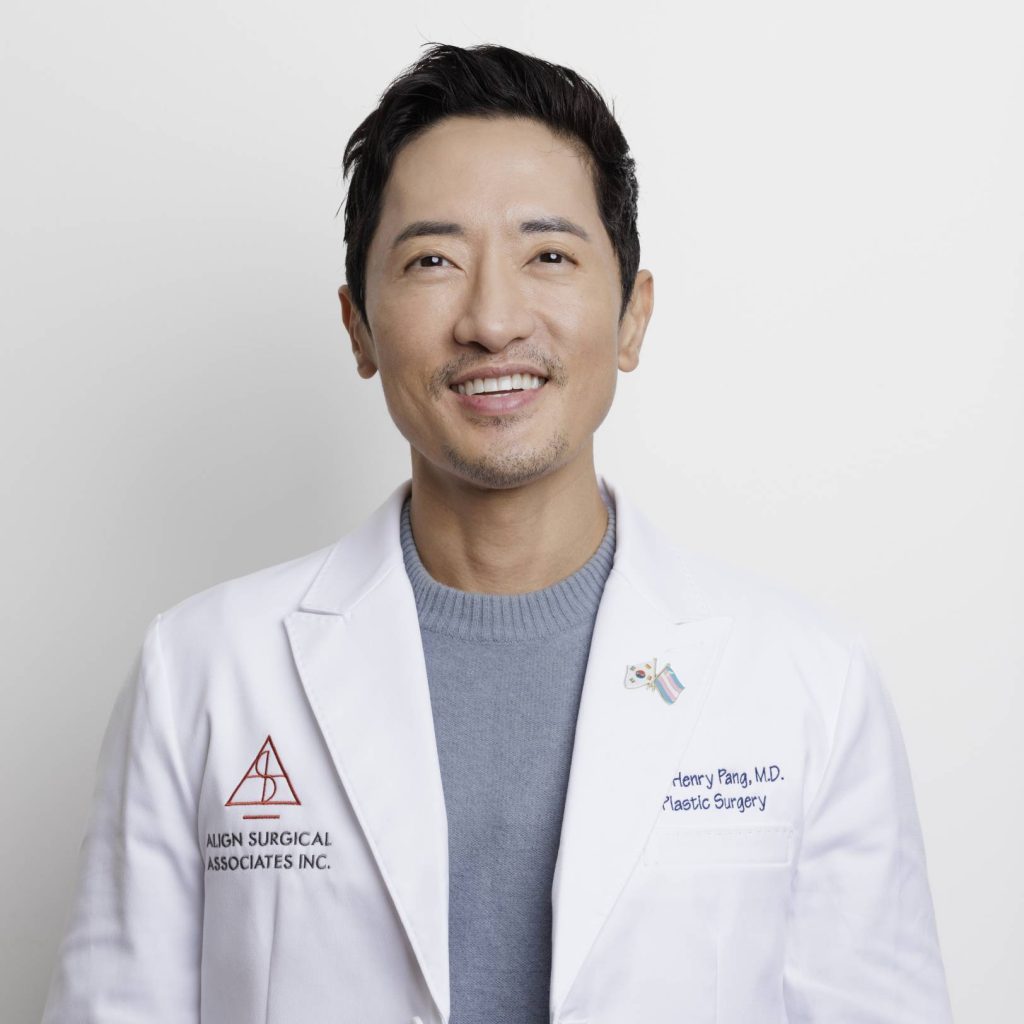 Professional portrait of Dr. Pang in a white medical coat