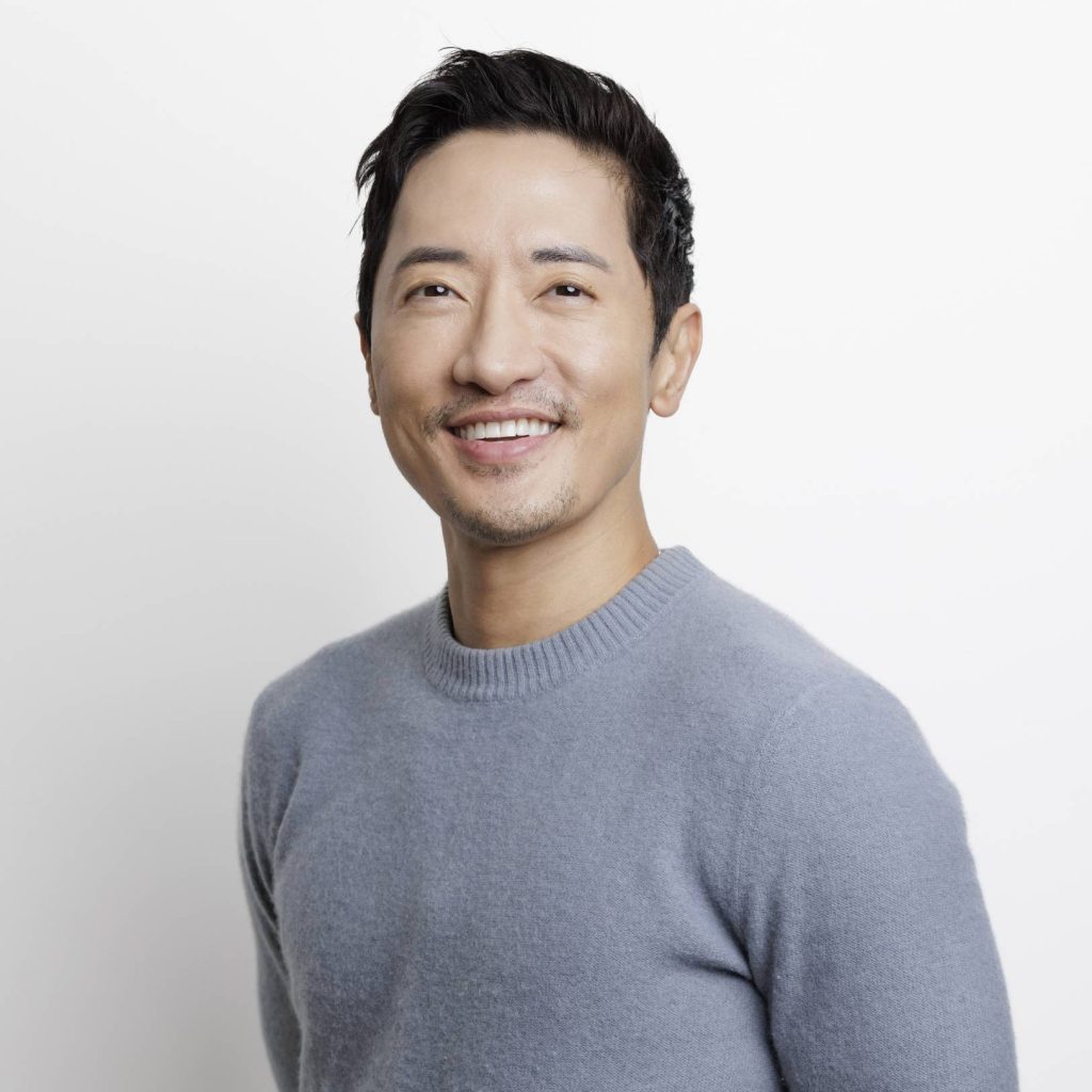 Professional portrait of Dr. Pang in a gray shirt
