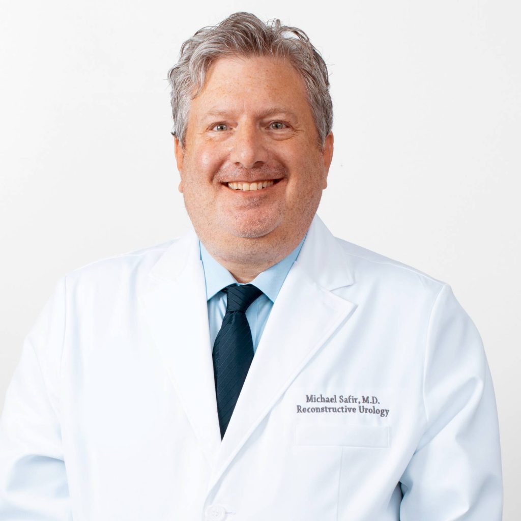 Professional portrait of Dr. Safir in a white medical coat